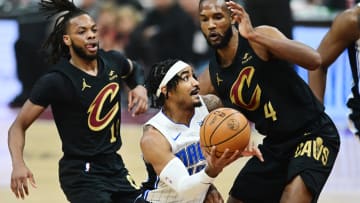 Apr 30, 2024; Cleveland, Ohio, USA; Orlando Magic guard Gary Harris (14) drives to the basket against Cleveland Cavaliers forward Evan Mobley (4) during the first quarter in game five of the first round for the 2024 NBA playoffs at Rocket Mortgage FieldHouse. Mandatory Credit: Ken Blaze-USA TODAY Sports