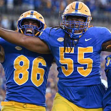 Sep 14, 2024; Pittsburgh, Pennsylvania, USA; Pittsburgh Panthers running back Derrick Davis Jr. (34) celebrates a touchdown with BJ Williams (55) and Gavin Bartholomew (86) during the fourth quarter against the West Virginia Mountaineers at Acrisure Stadium. Mandatory Credit: Barry Reeger-Image Images