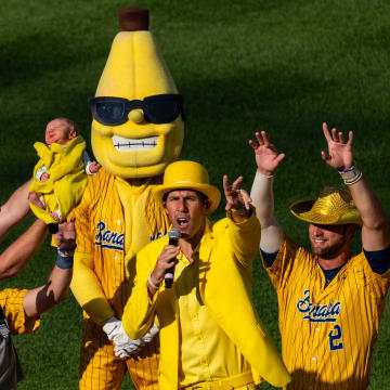 The Savannah Bananas hold up a baby Thursday, June 27, 2024, during a Savannah Bananas World Tour show at Victory Field in Indianapolis.