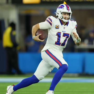 Dec 23, 2023; Inglewood, California, USA; Buffalo Bills quarterback Josh Allen (17) carries the ball against the Los Angeles Chargers in the first half at SoFi Stadium. Mandatory Credit: Kirby Lee-USA TODAY Sports