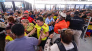 Fans rush the gates before the Copa America Final match between Argentina and Colombia at Hard Rock Stadium.