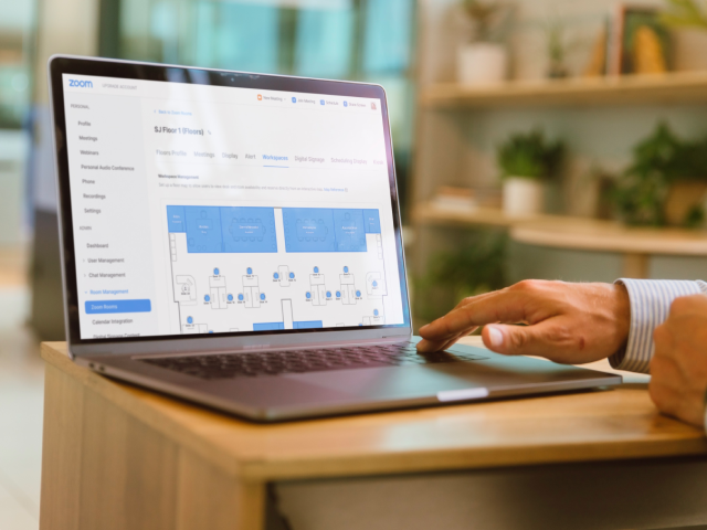 Man reviewing floor plans on computer