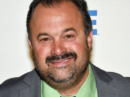 Frank Fritz Smiling With a Green Shirt And Tie