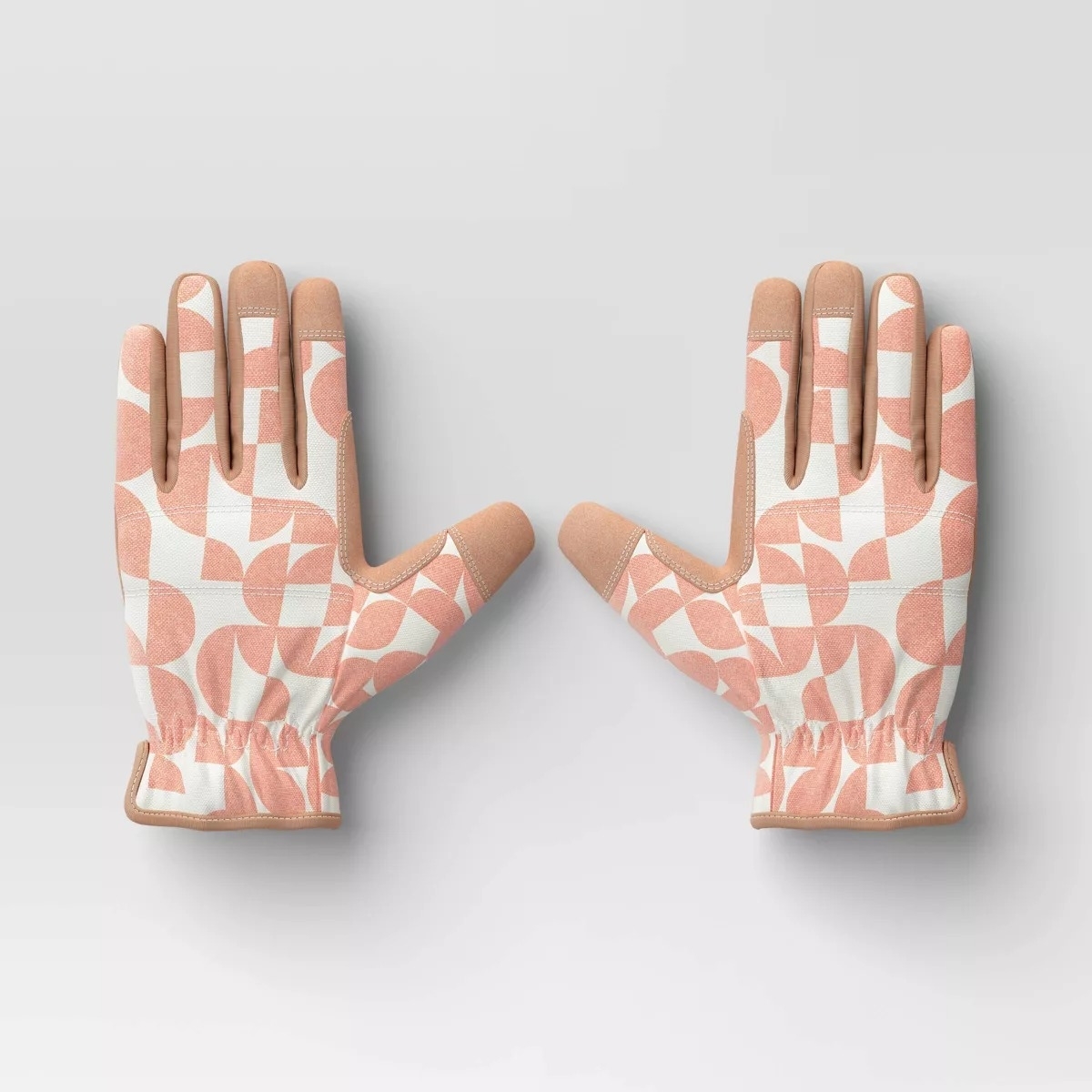 Pair of patterned gardening gloves with geometric designs, displayed openly with palms facing down