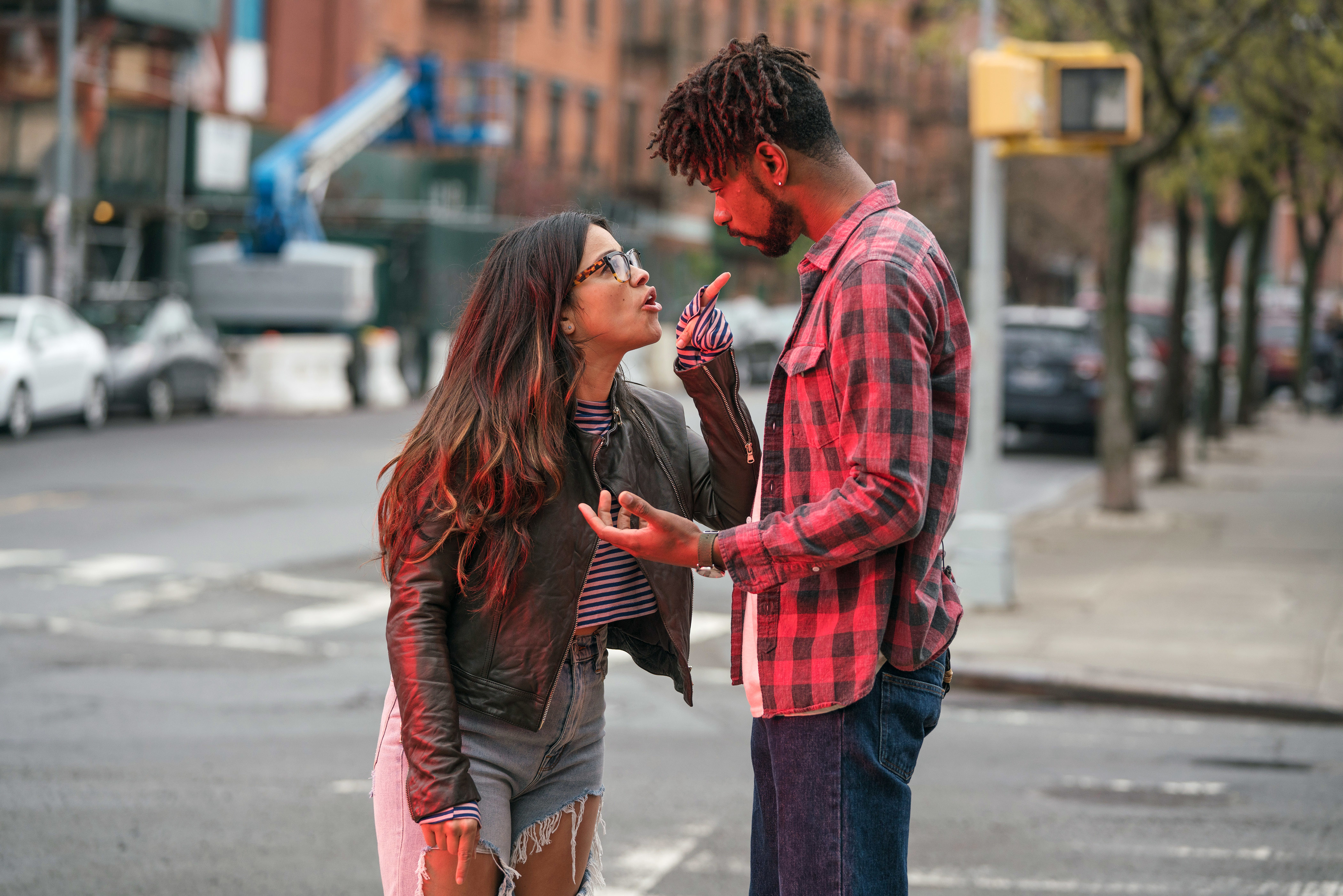 Gina Rodriguez and LaKeith Stanfield arguing on the street in &quot;Someone Great.&quot;