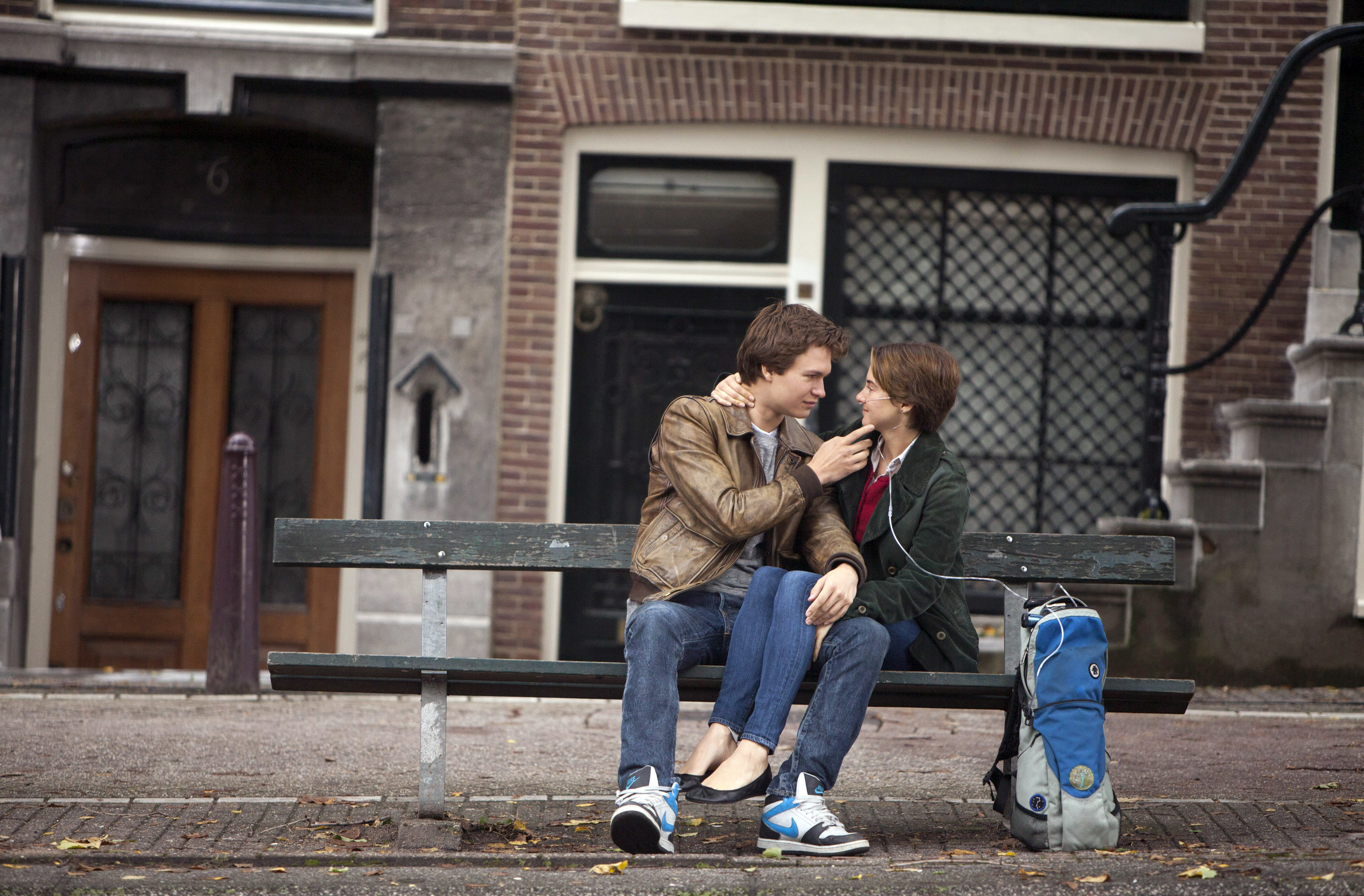 Ansel Elgort and Shailene Woodley sitting on a bench in &quot;The Fault in Our Stars.&quot;