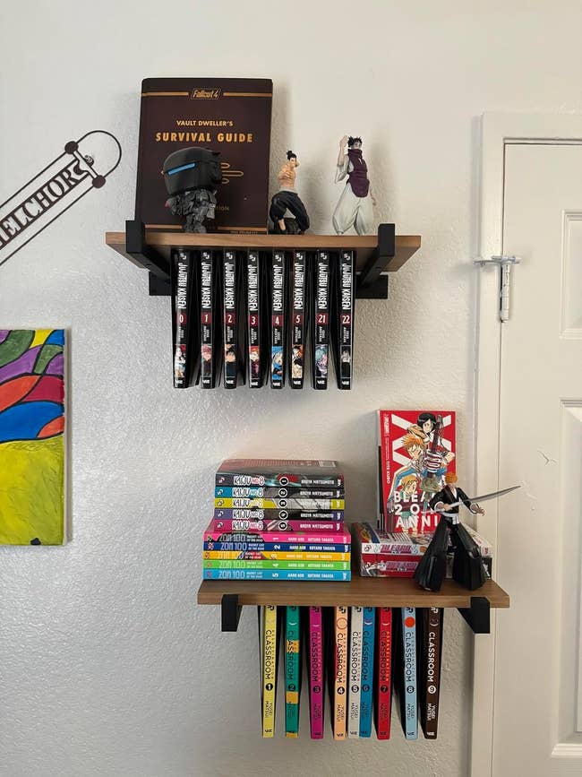 Two shelves with figurines and manga books, including 