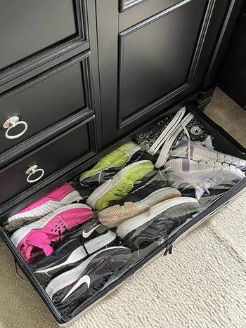 Storage drawer filled with various athletic shoes, including brands like Nike, arranged neatly for easy access