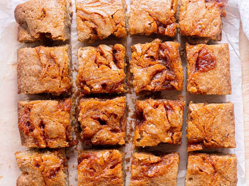 Gochujang blondie bars on parchment paper.