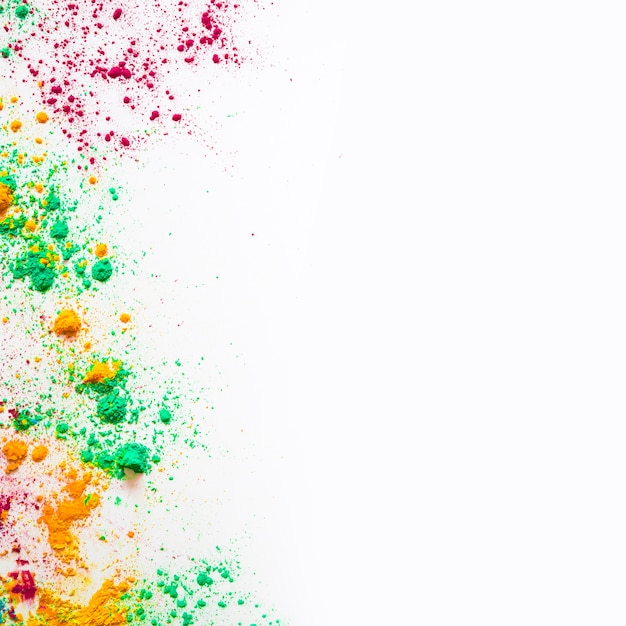 Foto gratuita polvere di colore holi con copia spazio per scrivere testo su sfondo bianco