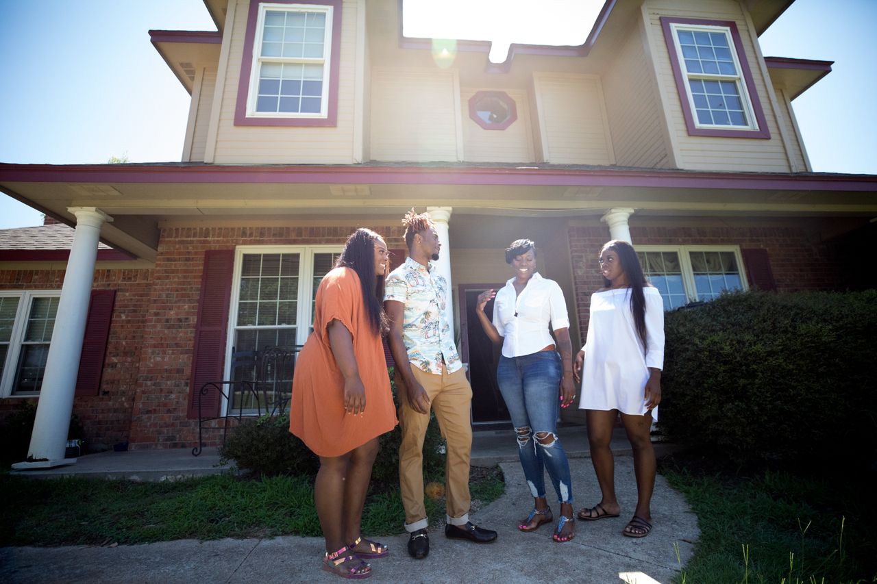 Mason, third from left, photographed outside her home in Rendon, Texas, with her children Taylor Hobbs, Sanford Hobbs and Keyoshia Hobbs.