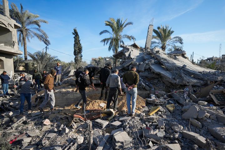 Palestinians look at home destroyed by an Israeli strike late Saturday in Deir al-Balah Sunday, Dec. 22, 2024. At least eight people were killed according to the hospital which received the bodies.(AP Photo/Abdel Kareem Hana)