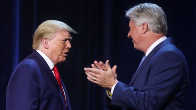 U.S. President Donald Trump is greeted by Pastor Robert Morris