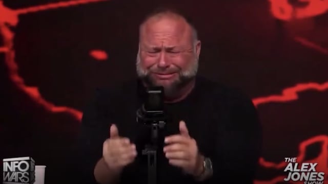 Screenshot of Alex Jones crying.