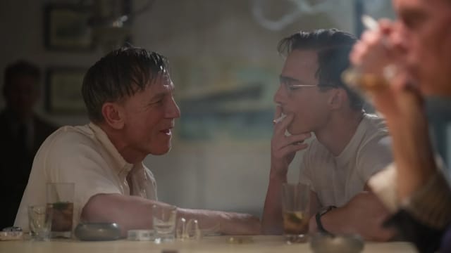 A photo still of Daniel Craig and Drew Starkey in Queer