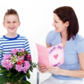 Son giving mom gifts on Mother's Day.