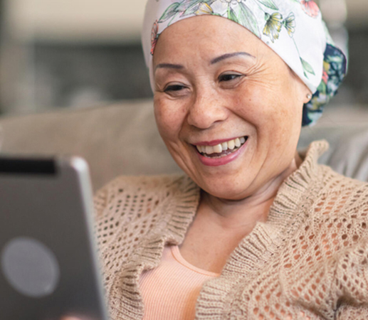 Woman in scarf looking at tablet