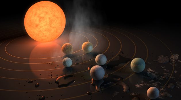 Two separate teams of scientists from the CfA have identified major challenges for the development of life in TRAPPIST-1. The TRAPPIST-1 system, depicted here in an artist's conception, contains seven roughly Earth-sized planets orbiting a red dwarf, which is a faint, low-mass star. This star spins rapidly and generates energetic flares of ultraviolet radiation and a strong wind of particles. The research teams say the behavior of this red dwarf makes it much less likely than generally thought that the three planets orbiting well within the habitable zone could support life.
(Image courtesy NASA/JPL-Caltech/R. Hurt)