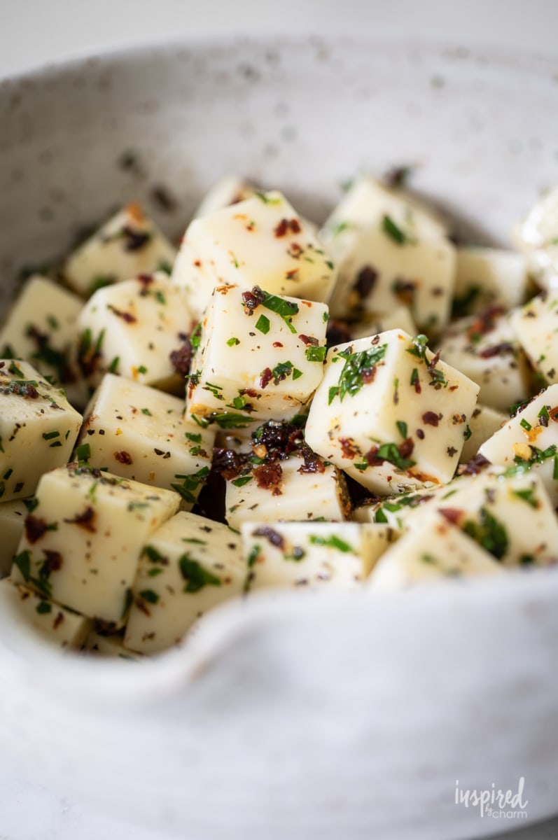 marinated mozzarella cubes in a bowl.