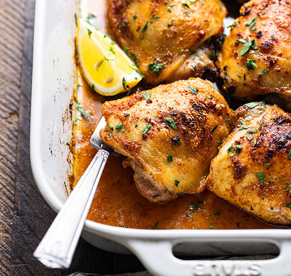 roasted chicken thighs in a baking pan