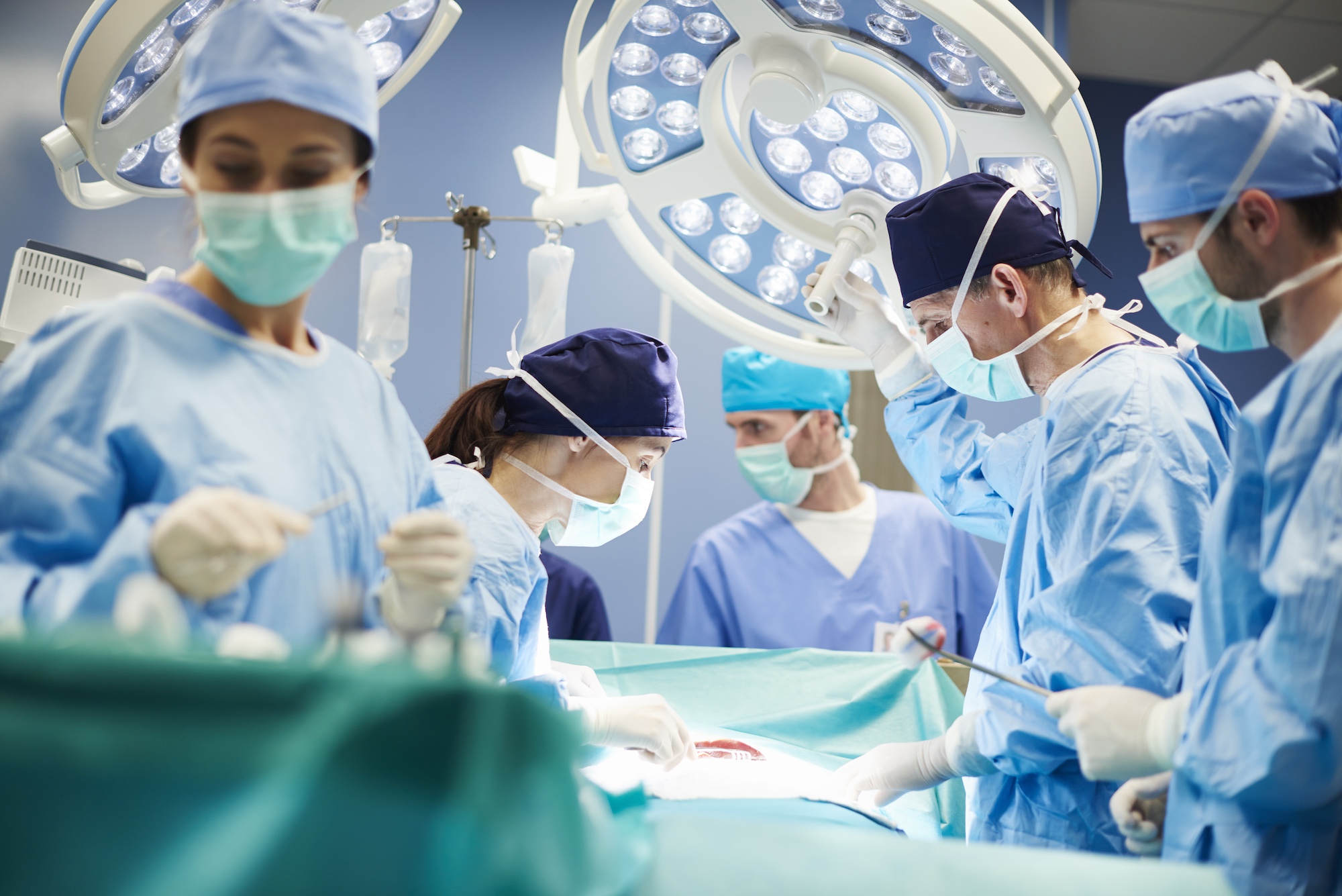 Group of surgeons in operating room