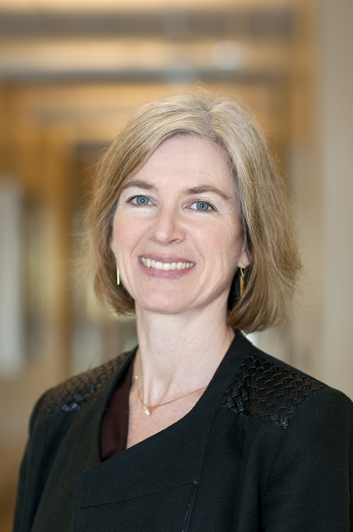 A headshot of  Jennifer A. Doudna, Ph.D. in a black top 