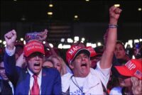 Supporters cheer as former President Donald Trump exceeds the projected Electoral College threshold of 270 votes for victory. (AP Photo/Evan Vucci)