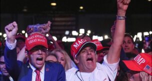 Supporters cheer as former President Donald Trump exceeds the projected Electoral College threshold of 270 votes for victory. (AP Photo/Evan Vucci)