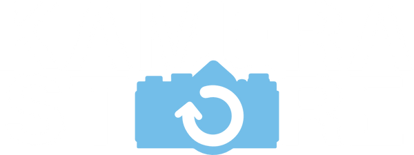 White and blue logo for Kamerastore on a transparent background.