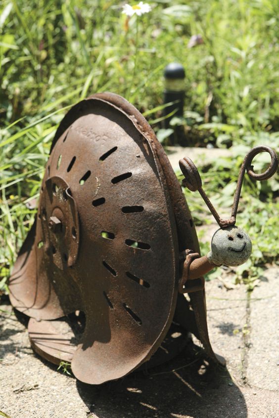 Tractor Seat Snail Yard Art