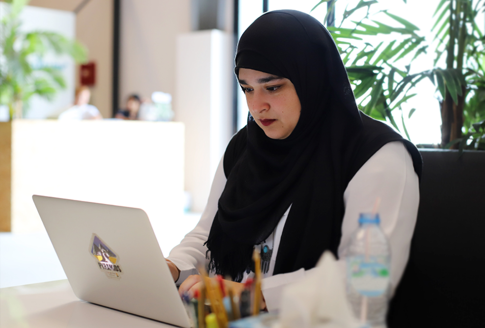 A woman working on laptop