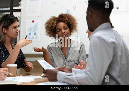 African ceo and staff do financial statement analysis at meeting Stock Photo