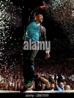 Coldplay frontman Chris Martin performs with the rest of the band at the American Airlines Arena in Miami, Florida. Stock Photo