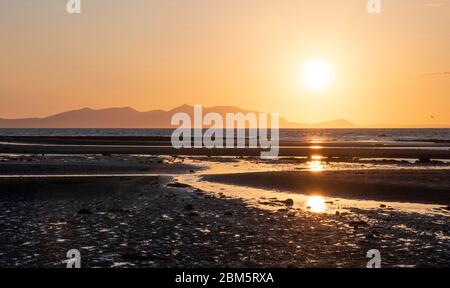 Arran sunset from beach at Greenan Castle, Heads of Ayr. Stock Photo