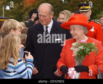 Britain's Queen Elizabeth II and The Duke of Edinburgh enjoy a walk about after visiting Old Government House in Fredericton, New Brunswick during their two week Royal visit to Canada. Stock Photo