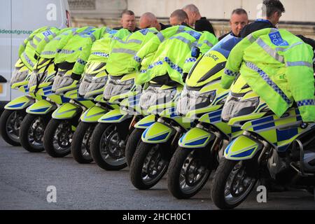 Row of BMW Metropolitan police motorbikes parked whilst officers  wait in Westminster, London, UK Stock Photo