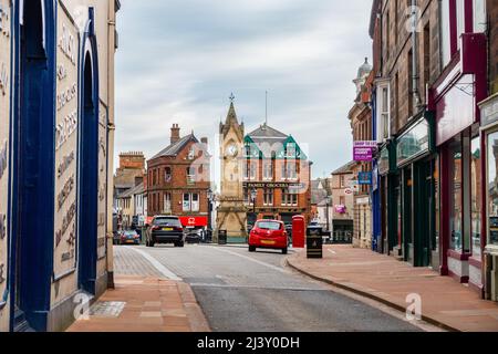 A view along Middle gate in Penrith, UK, looking towards Market Square and the clock tower or Musgrave Monument. Stock Photo