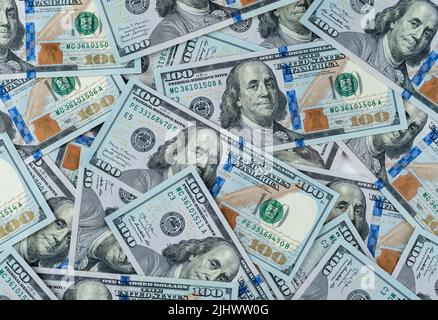 pile of one hundred US banknotes. Cash of hundred dollar bills, dollar background image. 100 bills background Stock Photo