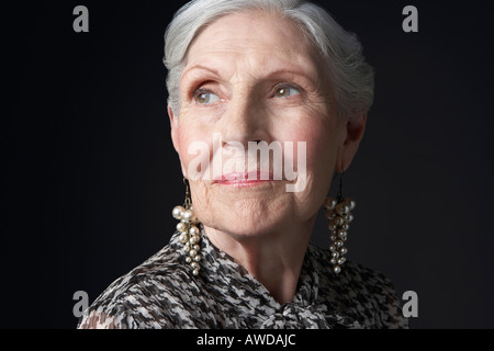 Senior Woman with Pearl Earrings Stock Photo