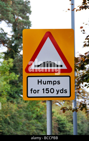 sign indicating humps ahead Stock Photo