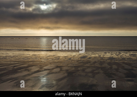 Sinister light over the beach at Low Hauxley on the Northumberland coast near Amble, England Stock Photo