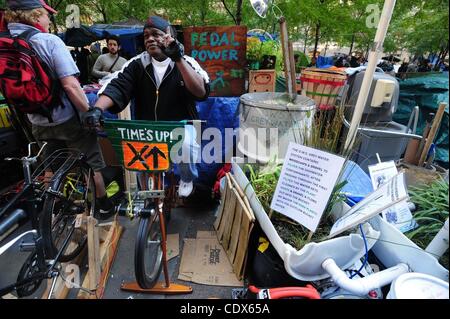 Nov. 1, 2011 - Manhattan, New York, U.S. - Robert Pearson of Parkchester, Bronx, pedals a bicycle for thirty-minutes to generate power for a generator as activists reside and meet in Zuccotti Park in lower Manhattan as Occupy Wall Street continues for the 46th day. (Credit Image: © Bryan Smith/ZUMAP Stock Photo