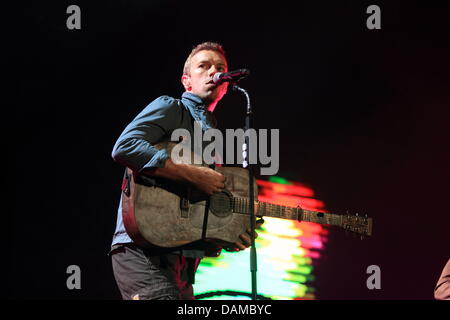 Chris Martin, frontman of the British rock band 'Coldplay' performs during the music festival Rock am Ring (Rock at the Ring) at the Nuerburgring, Germany, 04 June 2011. Organisers expect around 85,000 visitors to attend the three day festival on the race track in the Eifel. Photo: Thomas Frey Stock Photo