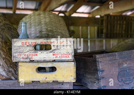 A Delux Beverages wooden crate among other vintage food and beverage crates stored in an old shed south of Montgomery, Alabama, USA. Stock Photo