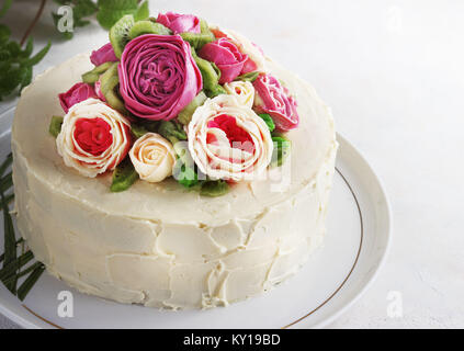 Birthday cake with flowers rose on white background Stock Photo