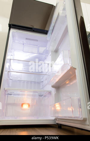 Contemporary kitchen with refrigerator and shelves Stock Photo - Alamy