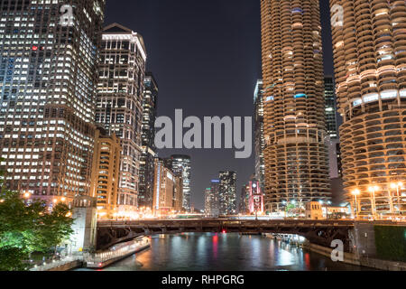 Downtown Chicago city skyline along the Chicago River at night Stock Photo