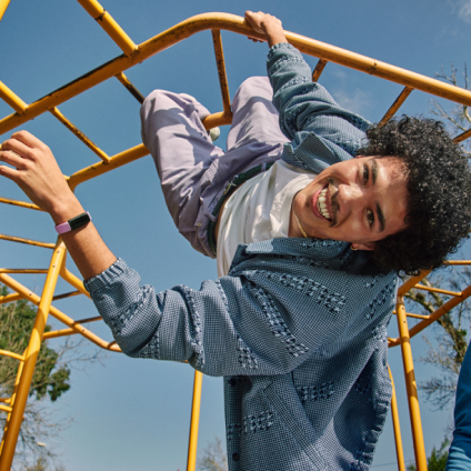 Person wearing Inspire 3 hanging on a jungle gym.