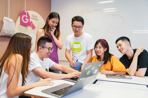 Googlers gathered at a computer