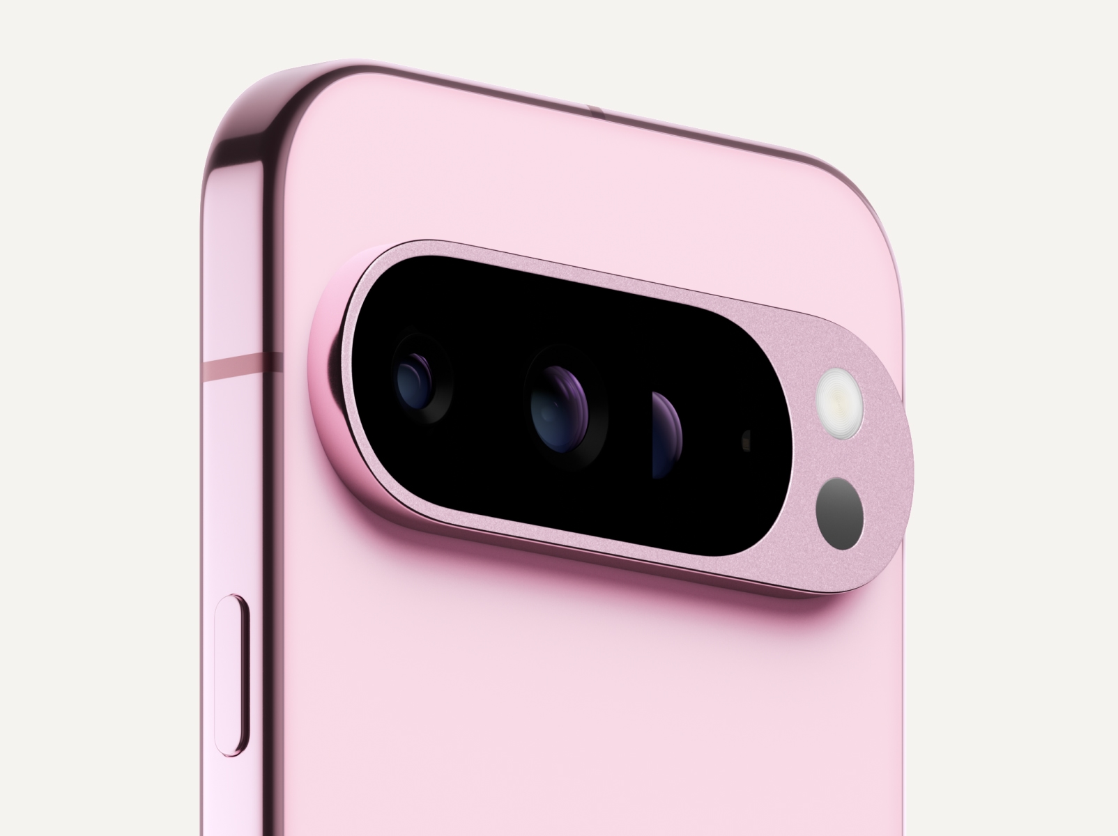 Angled close-up of the back of Pixel 9 Pro in Rose Quartz color.